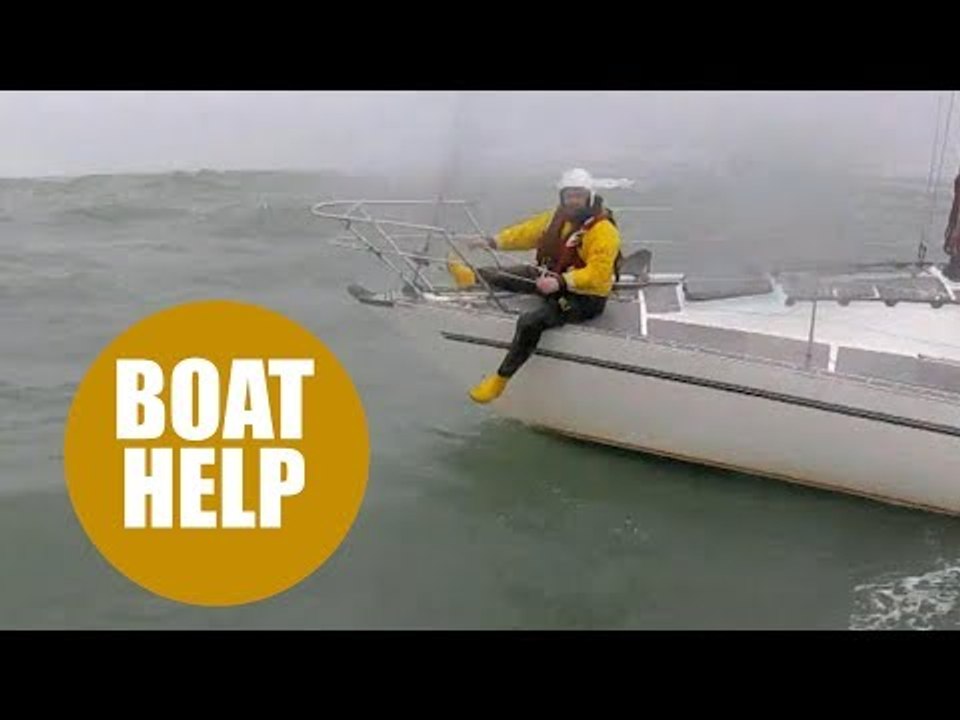 Lifeboat crew struggle to save stricken yacht