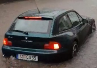 Cars Submerged on German Town's Streets Following Days of Rain