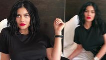 Kylie Jenner shows off sultry new lip kit as she coquettishly poses across her bed in black dress