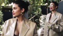 Kylie Jenner sports black lace bra and over-sized leather coat as she models new lip kit shade Jordy