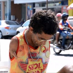 Man born without arms makes toy cars for a living