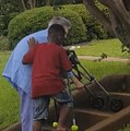 8-Year-Old Boy Helps Elderly Woman With Walker Up The Stairs