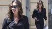 Victoria Beckham cuts stylish figure in low-cut black shirt and white heel boots as she runs errands in London