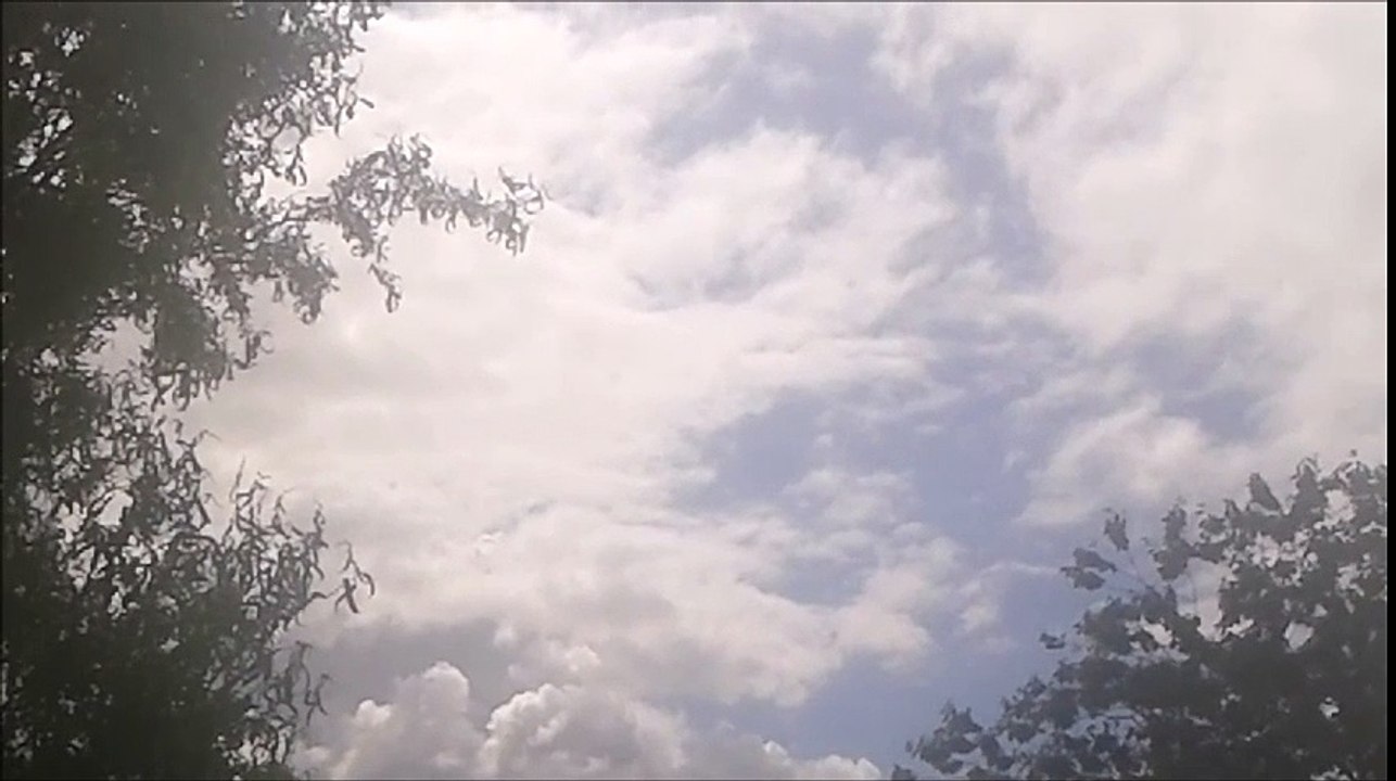 Beautiful Blue Sunny Sky with Slow Moving Clouds