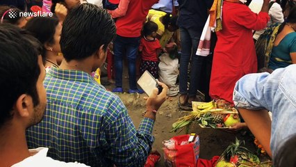 Worshippers bathe in highly polluted waters in northern India