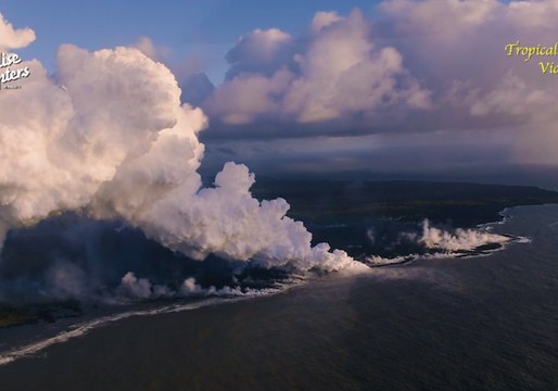 Smoke and Steam Towers Over Hawaiian Shore as Lava Streams Flow to the Ocean