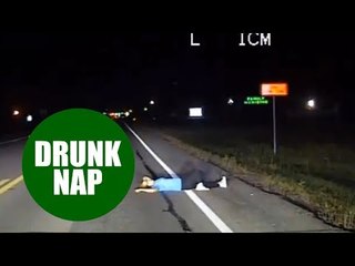 Dashcam reveals moment police discover an "intoxicated" woman taking a nap - in the road