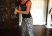 Woman Demonstrates the Perfect Wine Workout