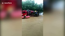 Get me to the exam on time! Firefighters transport students through China floods