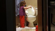 Toddler gets busted dumping toilet paper into toilet