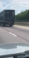 Man Hitches a Ride on a Semi