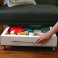 Add more storage to your living room with this secret roll-away storage drawer for under your couch! 