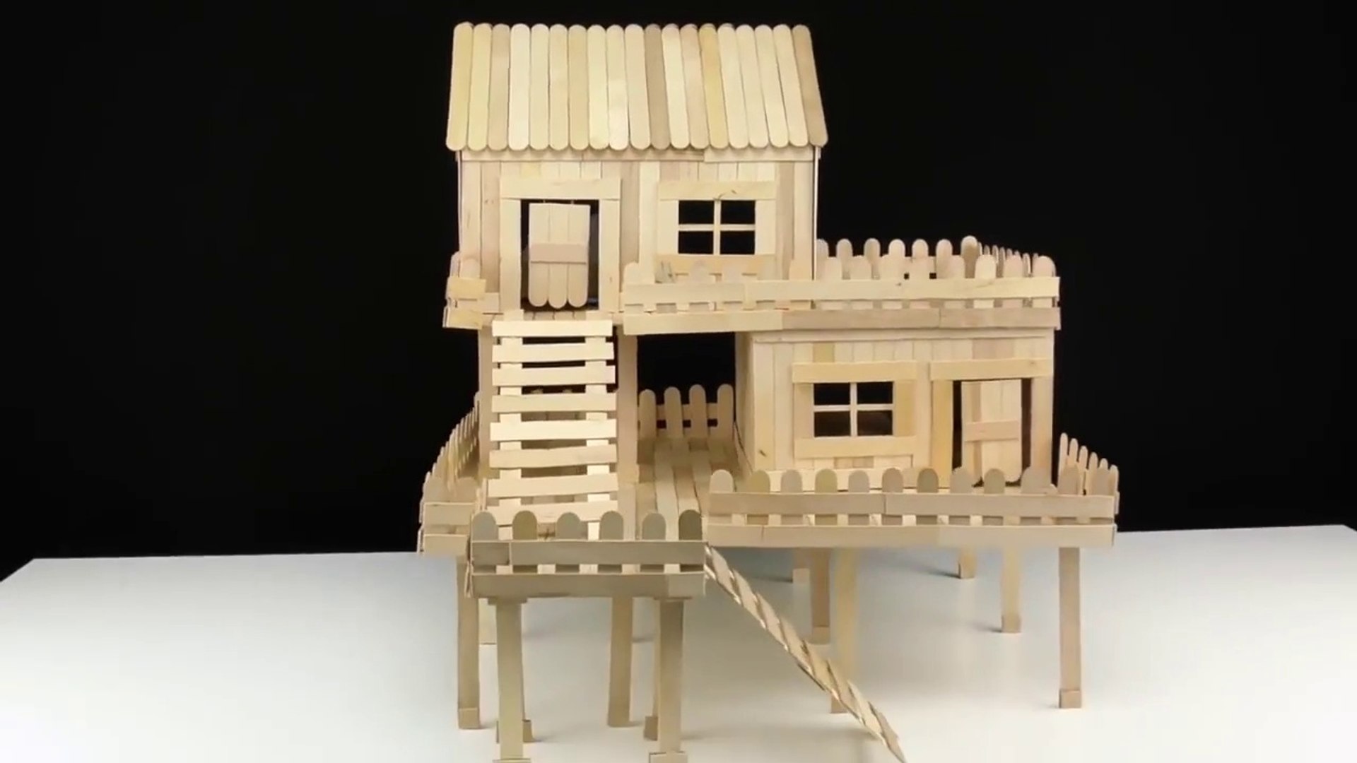 simple miniature house made of popsicle sticks