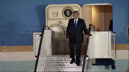 Donald Trump lands in Singapore for meeting with Kim Jong-un