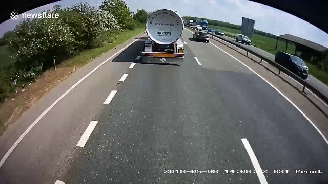Shocking moment tanker ploughs into back of HGV on UK A-road