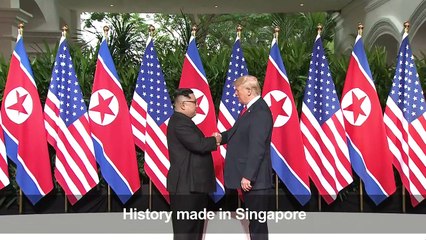 Trump, Kim shake hands at summit in Singapore