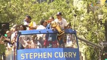 Steph Curry holds the trophy along with Ayesha and daughter Riley and the Warriors' fans go crazy  - Warriors Championship Parade - June 12, 2018