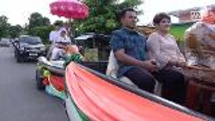 Would-be monk rides on jet ski in pre-ordainment ceremoney