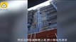 Un chinois sauve un enfant en escaladant un immeuble