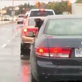 Dog eating rain out of car window Via Unilad