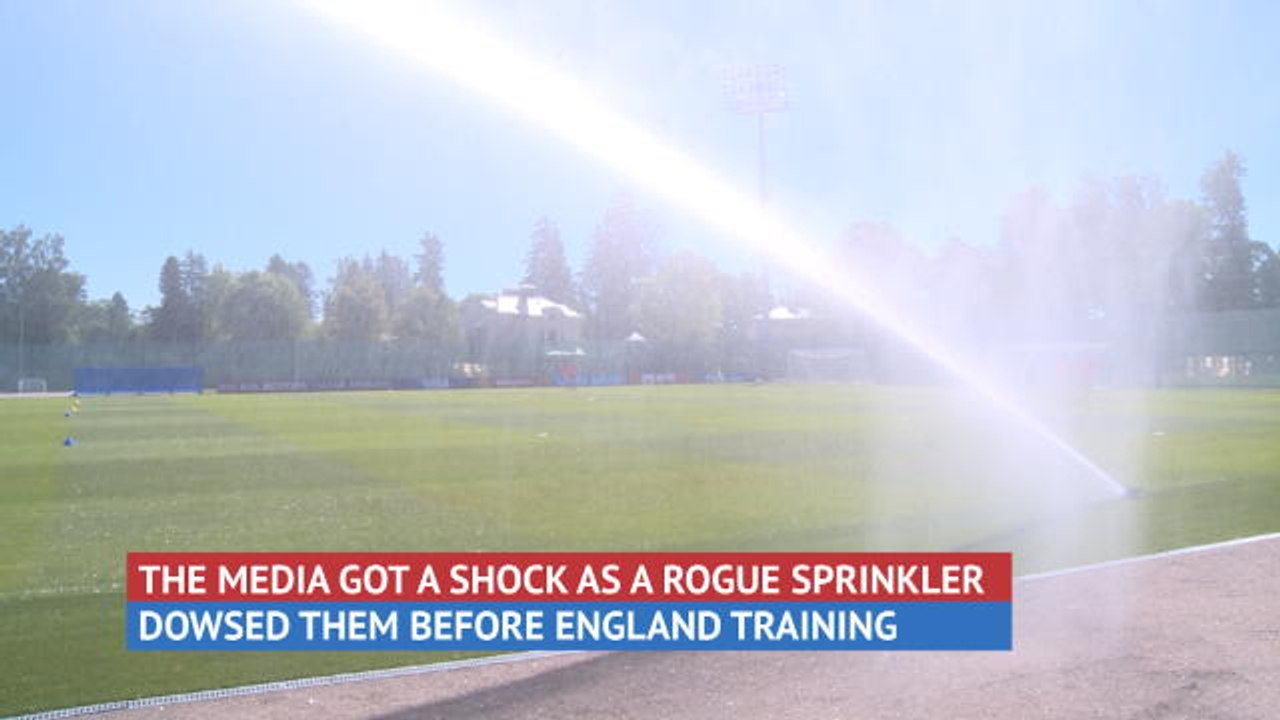 Behind the Scenes - Media get soaked at England training
