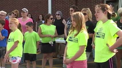 Community Covered in Neon Green Ribbons to Honor Teen Who Died from Cancer