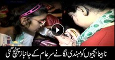 Sar-e-Aam team members visit visually impaired persons and apply henna