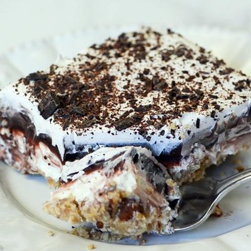 The NEXT BEST THING TO ROBERT REDFORD DESSERT has layers of creamy, chocolaty goodness on top of a pecan shortbread crust. This throwback to the 70’s dessert is