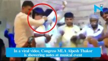 Congress MLA Alpesh Thakor showers money during event