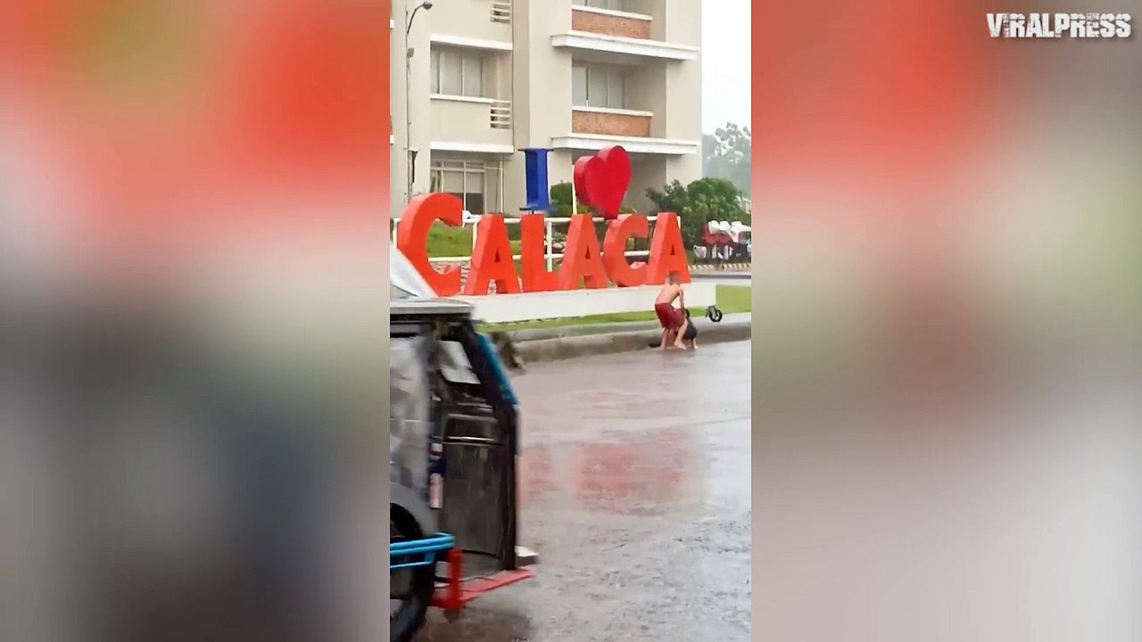 Kids Playing In Rain