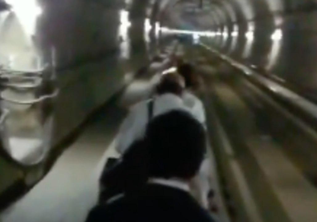 Kyoto Commuters Walk in Dark Tunnel After Quake Disrupts Train Services