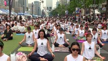 South Koreans stretch in Seoul for International Yoga Day