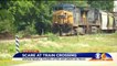 Driver Says Railroad Crossing Gate Trapped Her with Oncoming Train