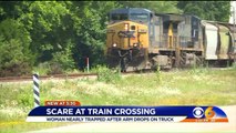 Driver Says Railroad Crossing Gate Trapped Her with Oncoming Train