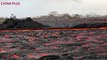 Lava from the eighth fissure of the Kilauea volcano flows towards the ocean as seen in Noni Farms, Kilauea on Hawaii's Big Island on June 15, 2018. Kilauea has