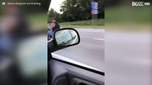 Man spotted texting while riding a motorcycle