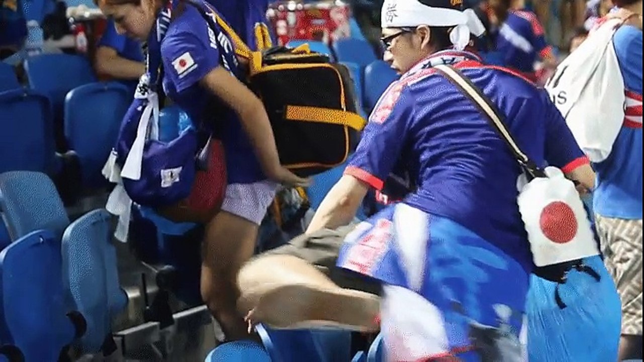 Japanese fans pick up trash after World Cup match