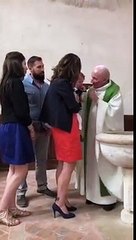 Priest slaps baby's head in church
