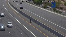 Woman runs across Loop 101 in Scottsdale