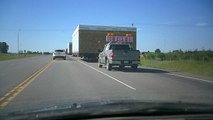 SUNP0018. BUILDINGS ARE BLOCKING THE ROAD. TALK ABOUT ROAD HOG. NO TIME FOR ROAD RAGE.RED DEER ALBERTA CANADA.