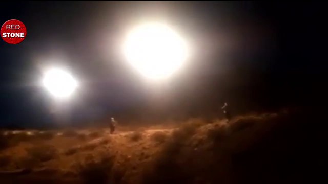 A group of courageous people approach the light balls UFO Orbs