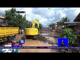 Petugas Dan Warga Bersihkan Lumpur Dari Banjir Bandang -NET12