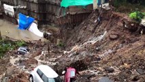 Wall collapses burying several cars following heavy rains in south Mumbai