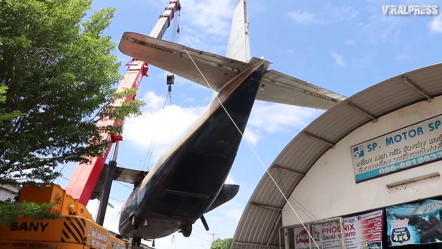 Vietnam-Era Plane Lifted Off Garage