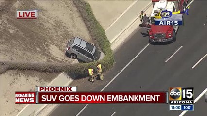 SUV goes down embankment along I-17