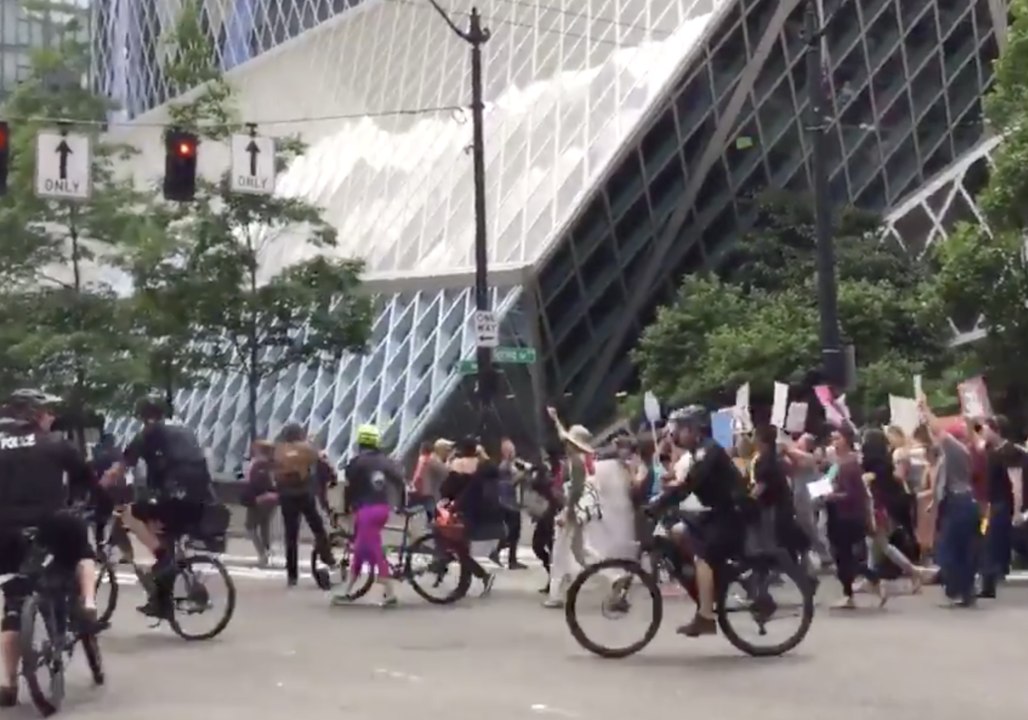 Protesters Against Supreme Court Ruling on Muslim Ban March in Seattle