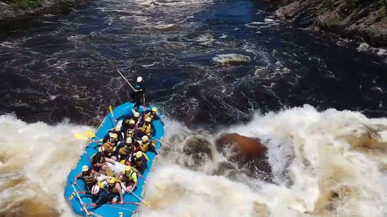 White-water rafting guide gets tossed out of boat after hitting big wave
