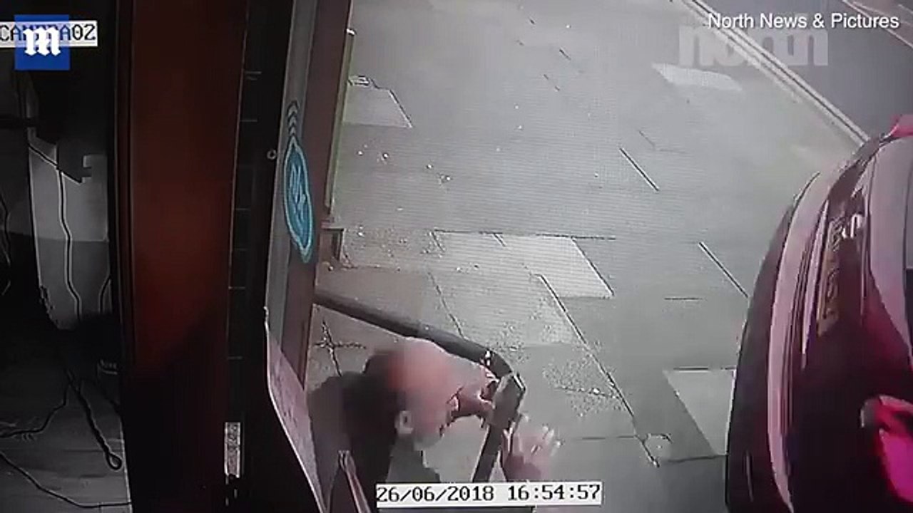 Barber has a close shave when narrowly avoiding wayward car - Daily Mail