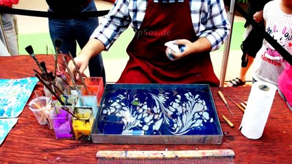 موهبة خارقة في الرسم على المياه شاهدوها بالفيديو