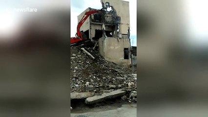 Lucky escape as digger rolls over with workman inside